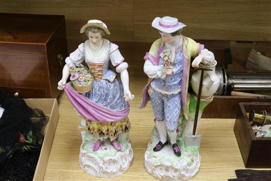 In the manner of Augustus Rex. A pair of Helena Wolfshon Dresden porcelain figures of gardeners, 36cm